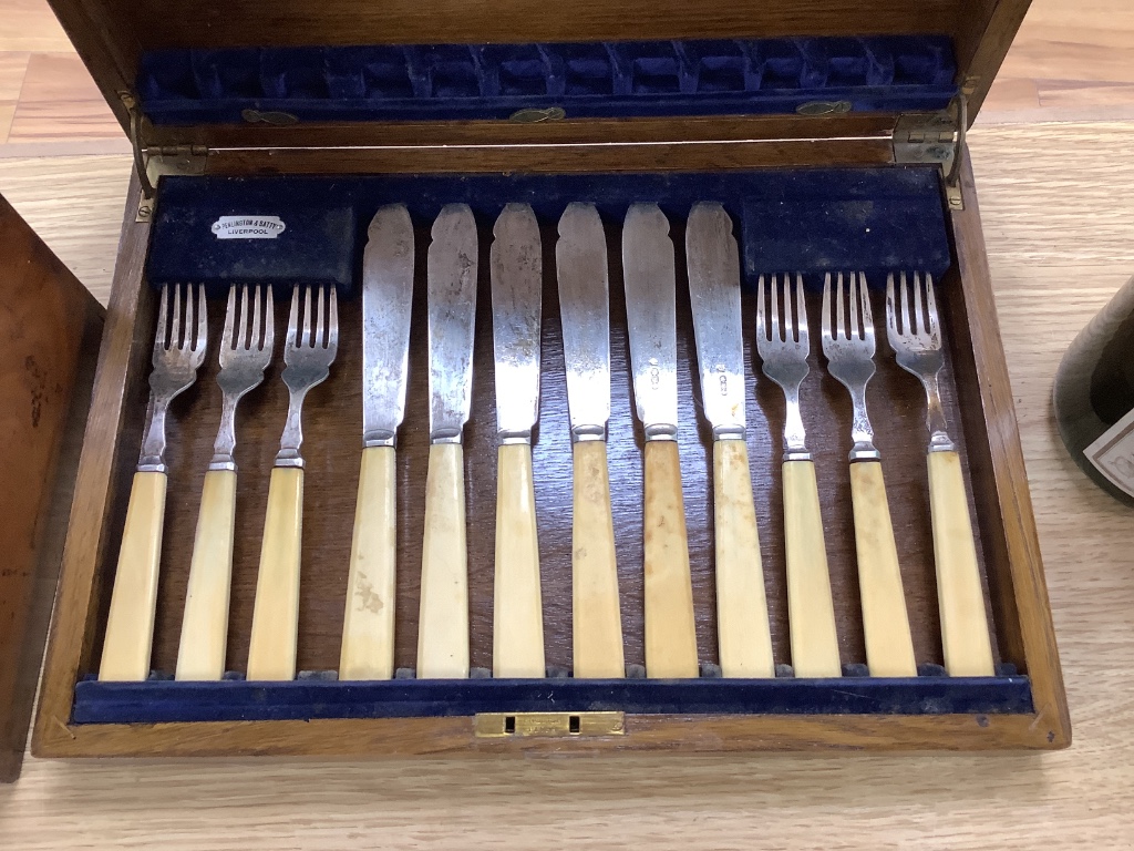 A Georgian knife box (converted to a stationery cabinet), a mahogany stationery box and a canteen of fish eaters